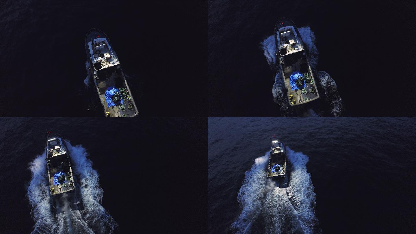 无人机拍摄的一名男子夜间驾船穿越海面