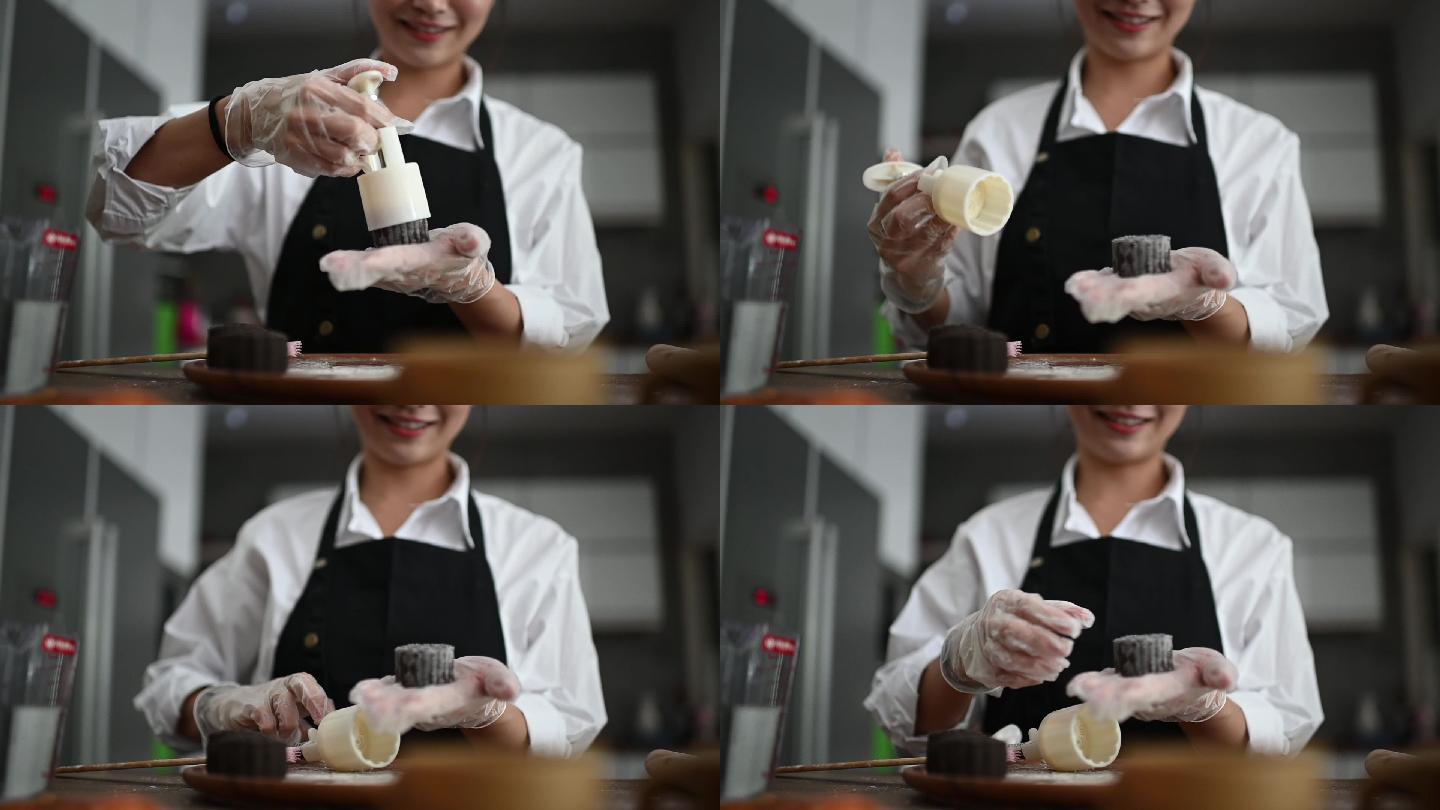 在制作月饼的女人磨具点心面点师女厨师手艺