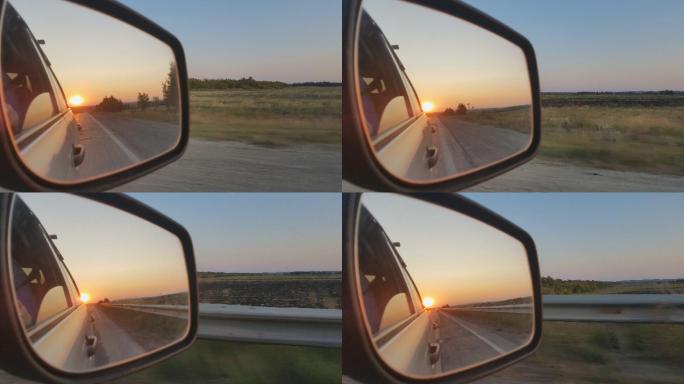 田野上美丽的日落，从车窗看到的景色