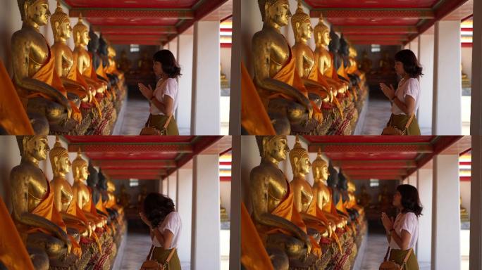 寺庙里祈祷的亚洲妇女