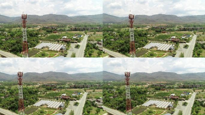 山区附近的乡村。电塔基站通讯设备信号传输