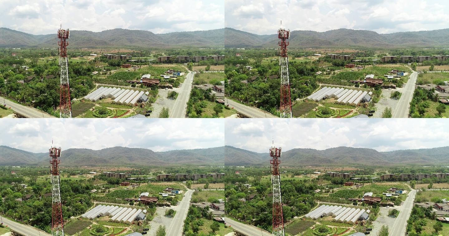 山区附近的乡村。电塔基站通讯设备信号传输