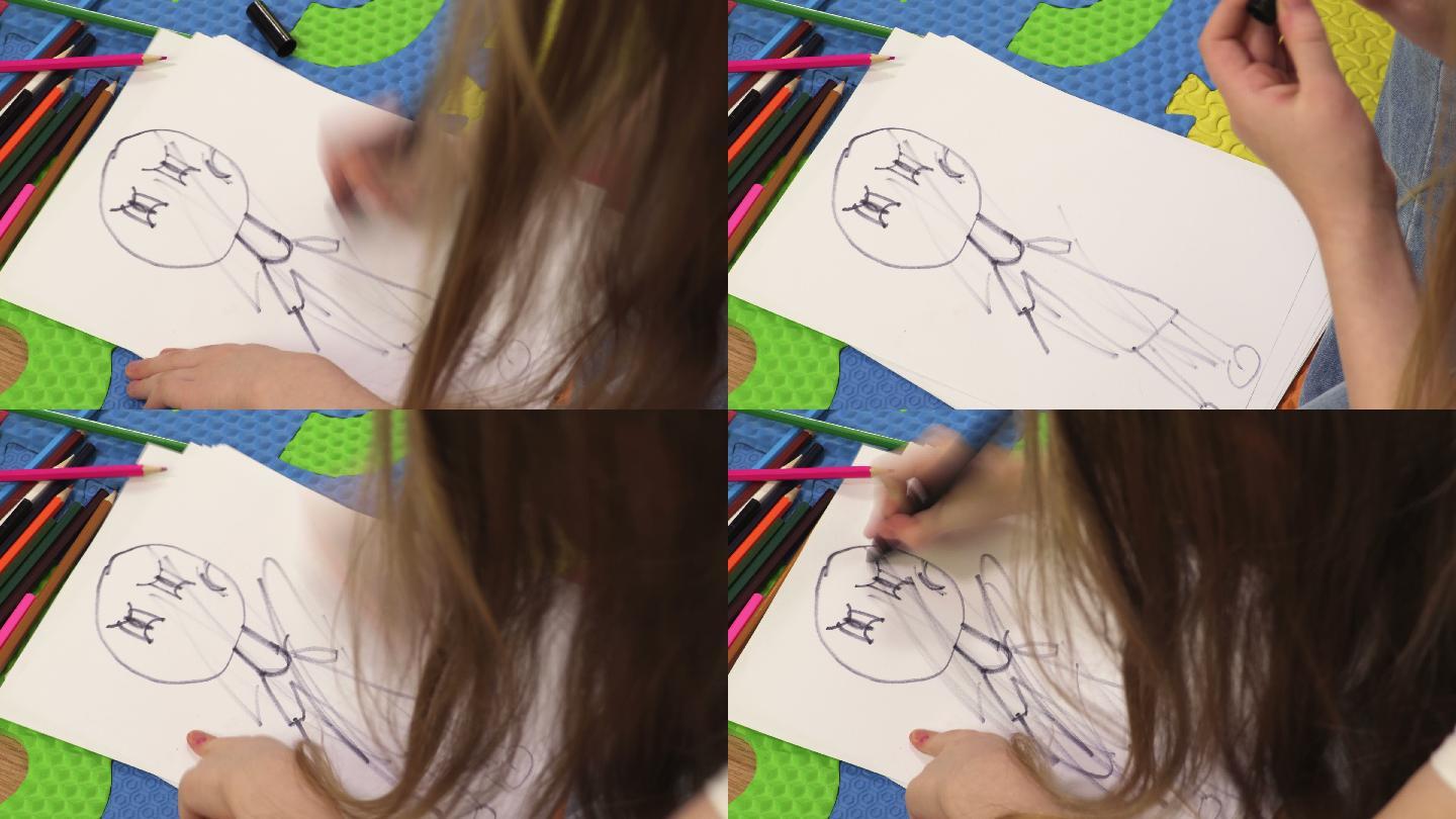 紧张的女孩用黑色笔画娃娃