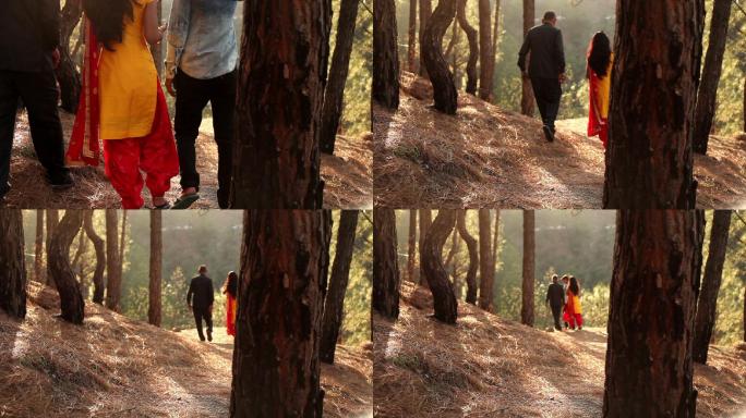 一家人在松树林散步