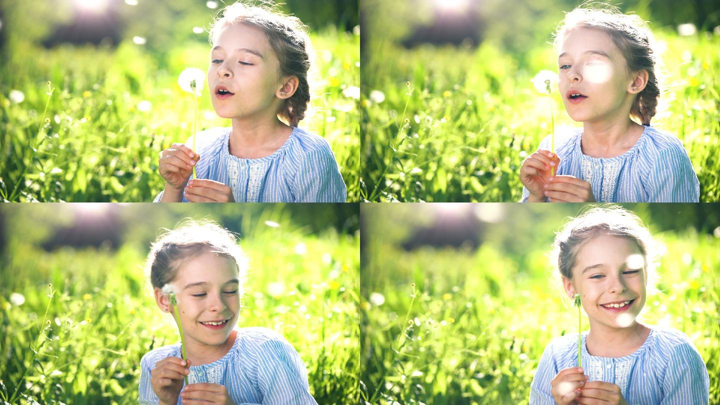 美丽的小女孩在夏日吹蒲公英。