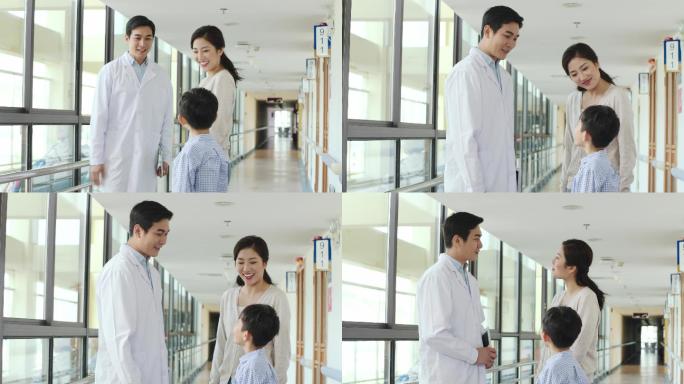 医生与母亲和儿子在医院交谈