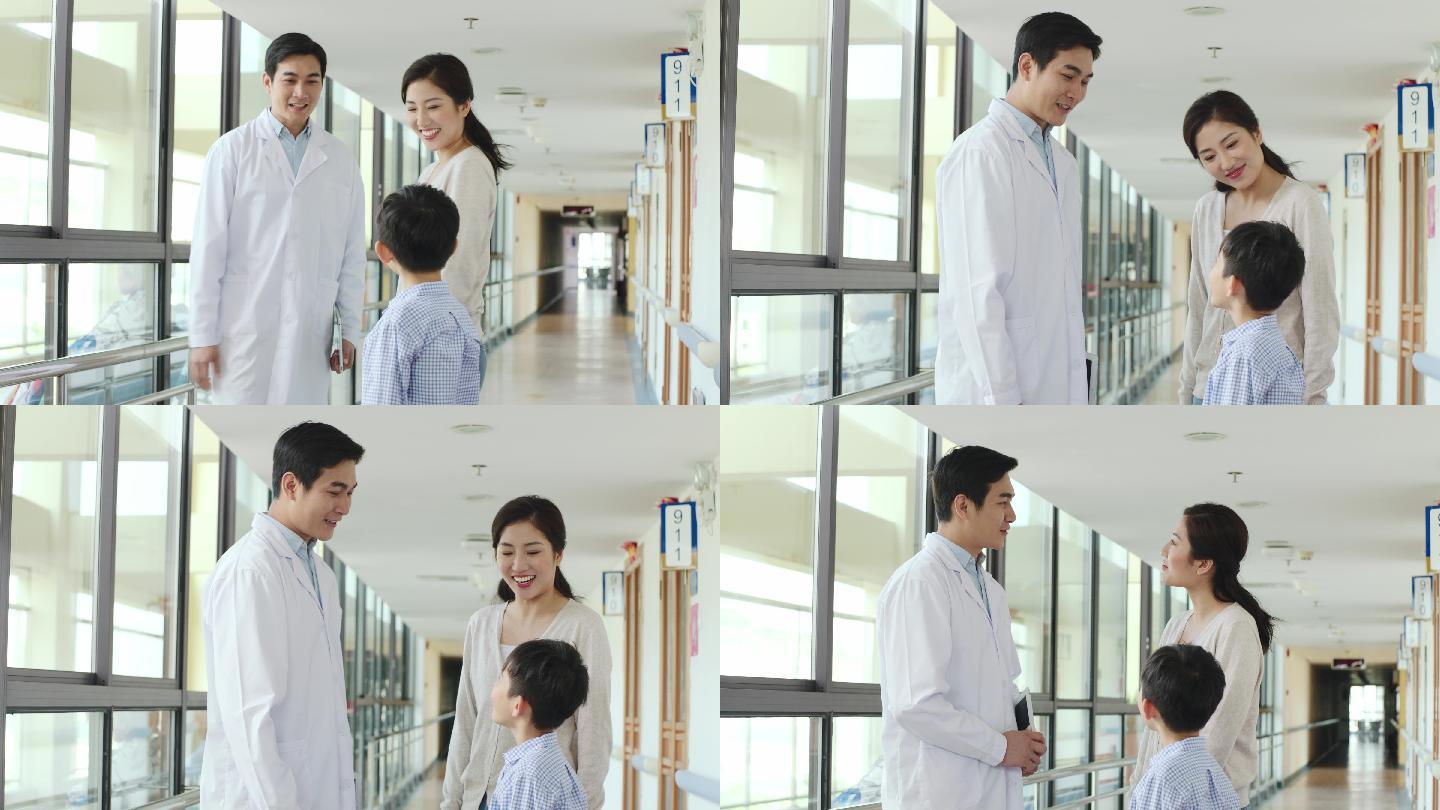 医生与母亲和儿子在医院交谈