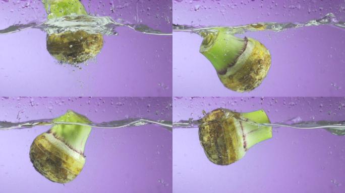 超慢镜头拍摄芋头根部溅水。