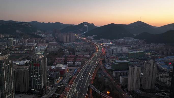 济南航拍城市晚霞夜景车流经十路立交桥