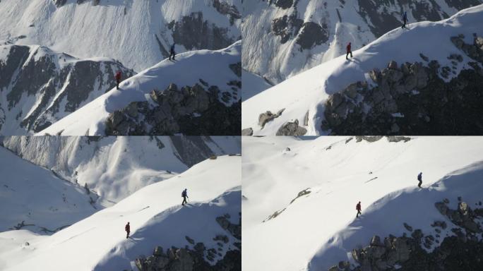 阳光下，两名登山者站在白雪覆盖的山上