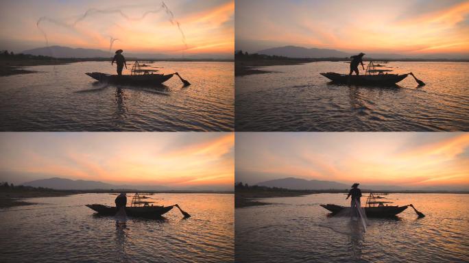 清晨，泰国渔夫在湖边钓鱼
