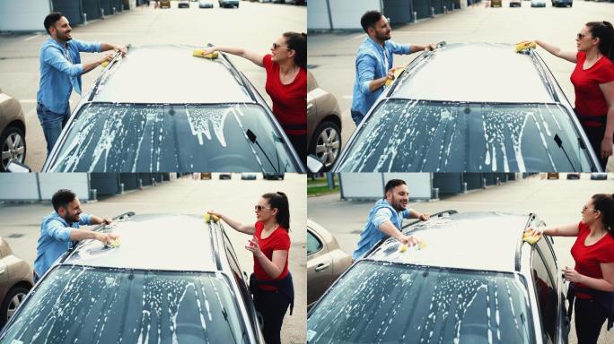 夫妇洗他们的车。