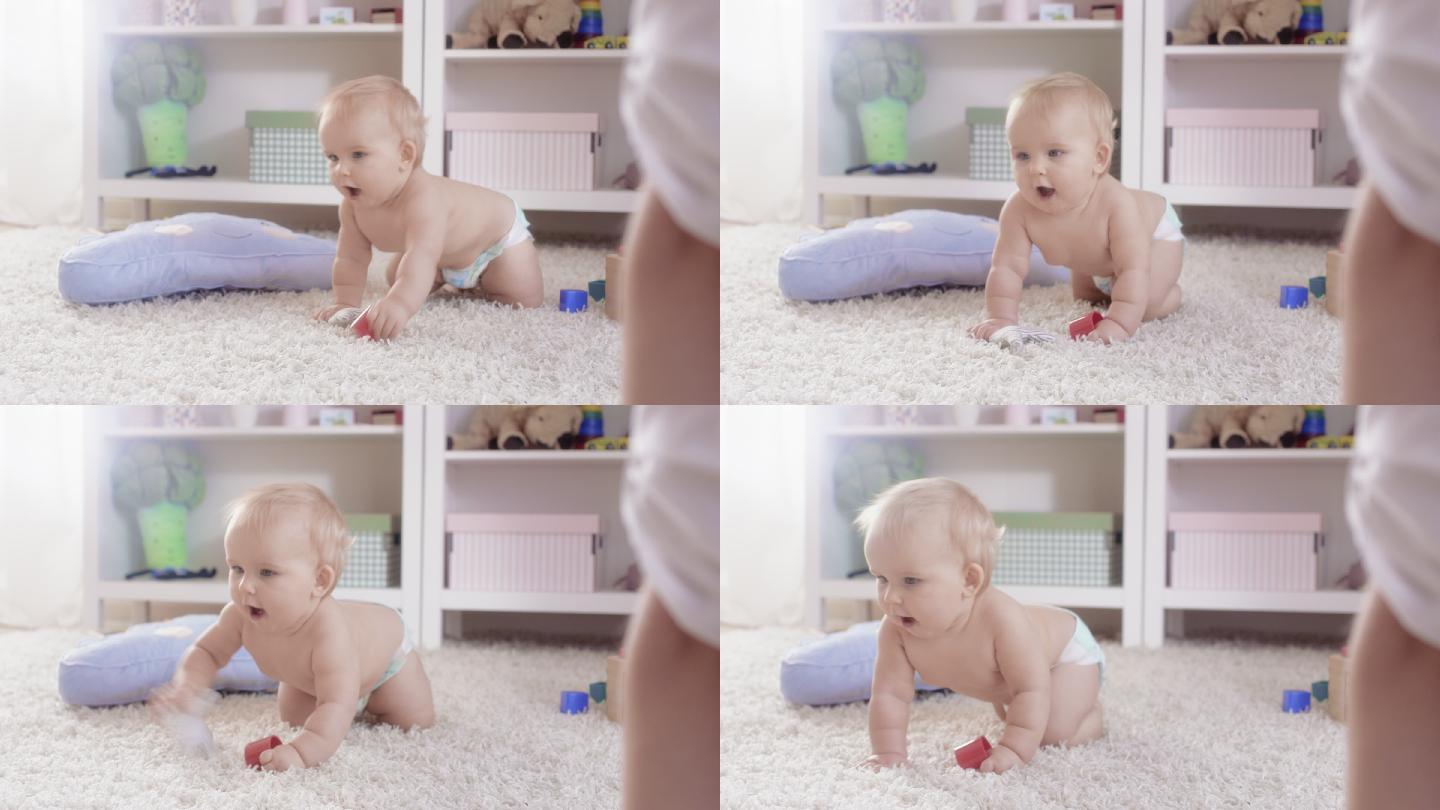 10个月大的女婴在地毯上爬着