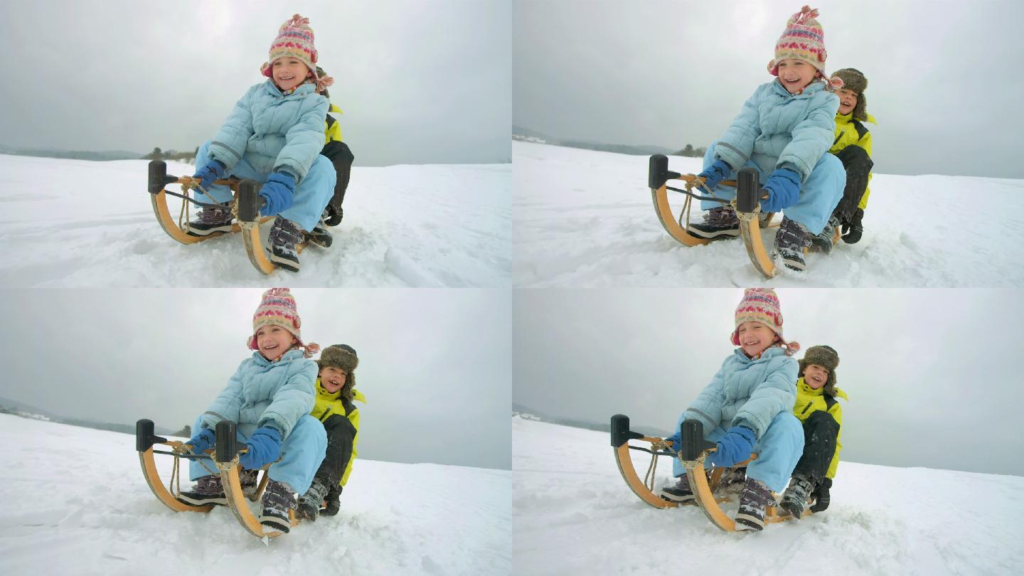 兄弟姐妹们在冬天玩雪橇