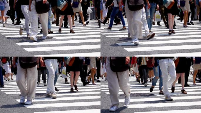 在日本东京，人们穿过涩谷路口的慢动作。