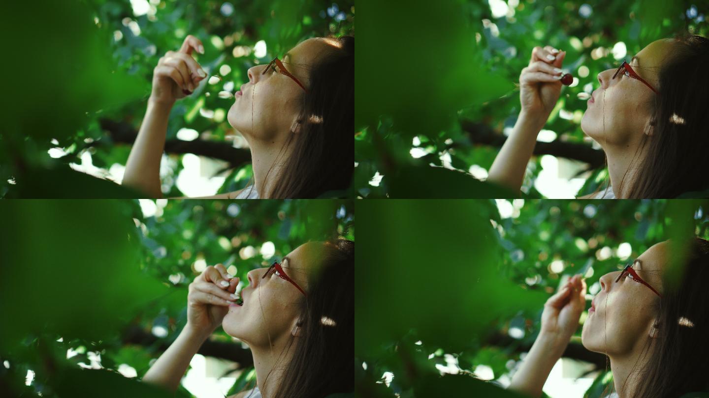 这位年轻女子喜欢吃树上的樱桃。