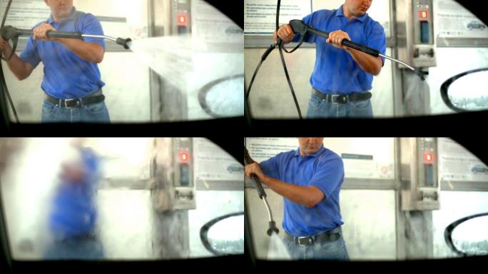 一个人用喷水器冲洗车窗