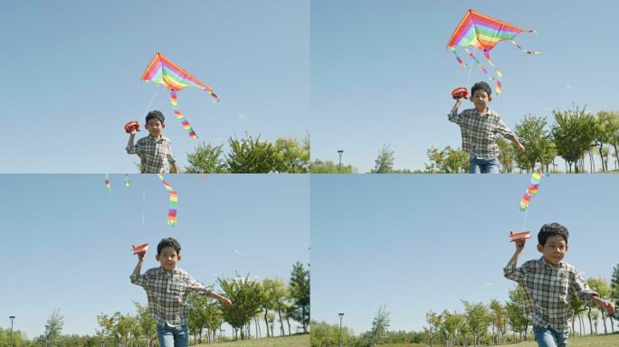 快乐的小男孩在草地上放风筝