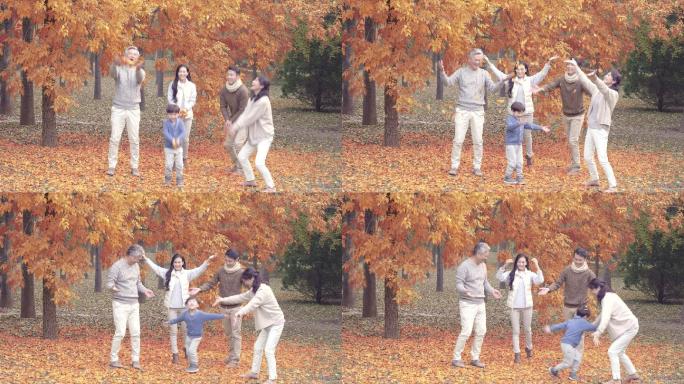 快乐家庭在秋日树林里玩耍