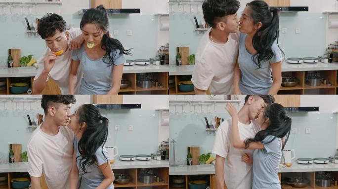 甜蜜的年轻夫妇在厨房接吻