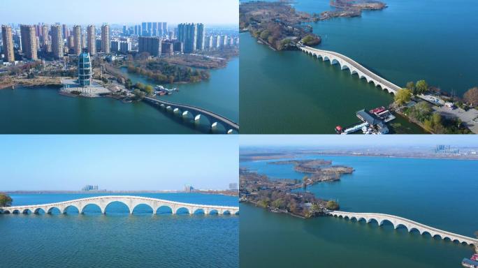 【4k】高清湖畔城市拱桥航拍高楼连云港