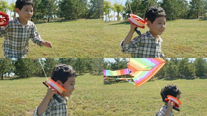 快乐的小男孩在草地上放风筝