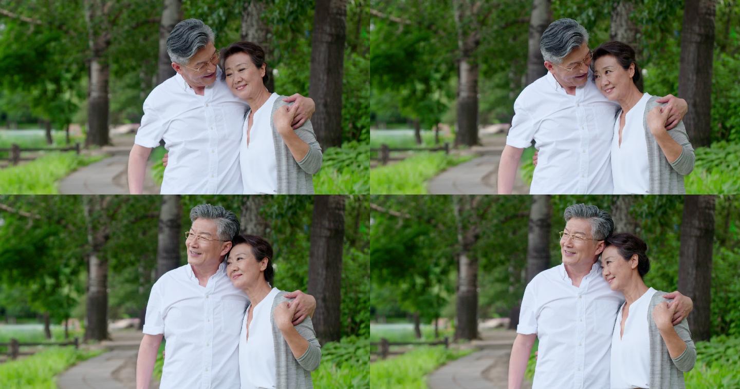 老年夫妇在公园老伴老夫妻拥抱相拥园区牵手
