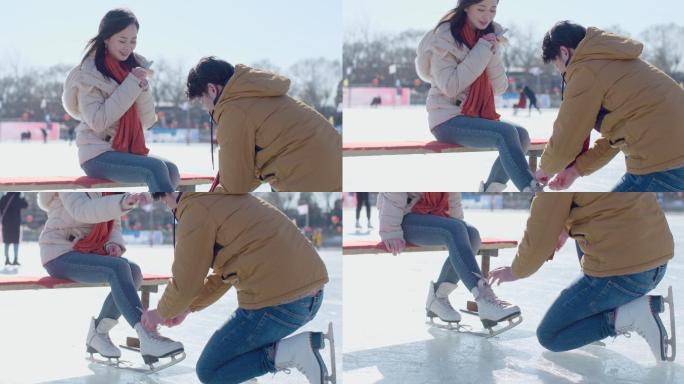 年轻情侣户外滑冰溜冰鞋