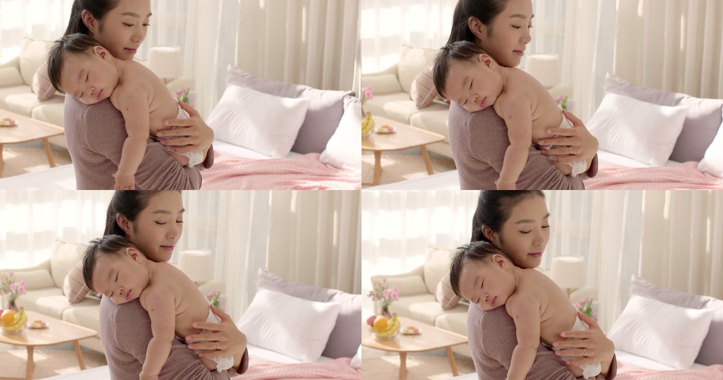 母亲抱着婴儿关爱安慰放松