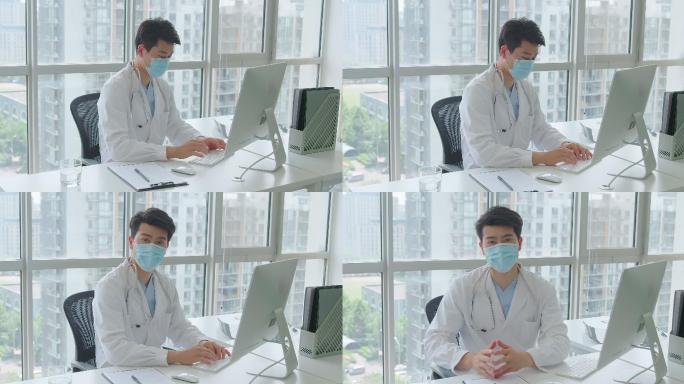 年轻的医生在办公室使用电脑