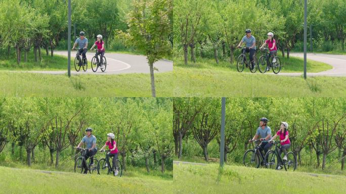 开心的中老年夫妇在公园骑自行车