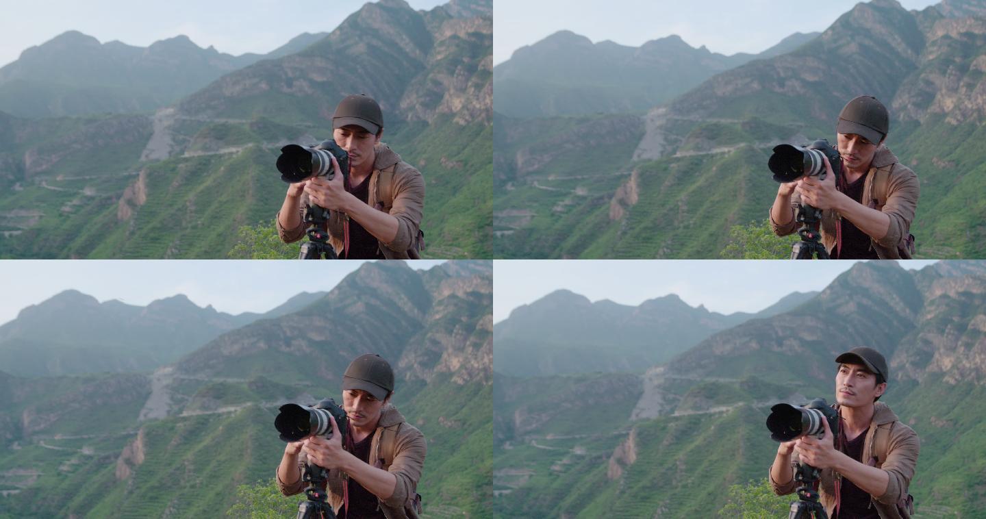 摄影师在户外拍照山旅游徒步旅行