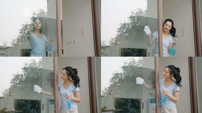 年轻女子做家务家务别墅玻璃