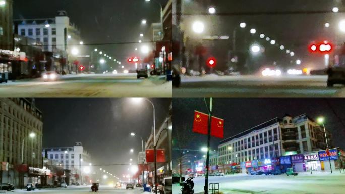 东北冬季雪夜夜晚的车灯路灯车流