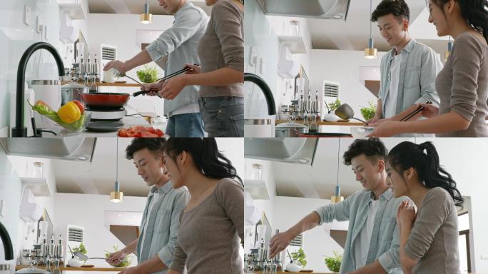 快乐的年轻夫妇在厨房做饭