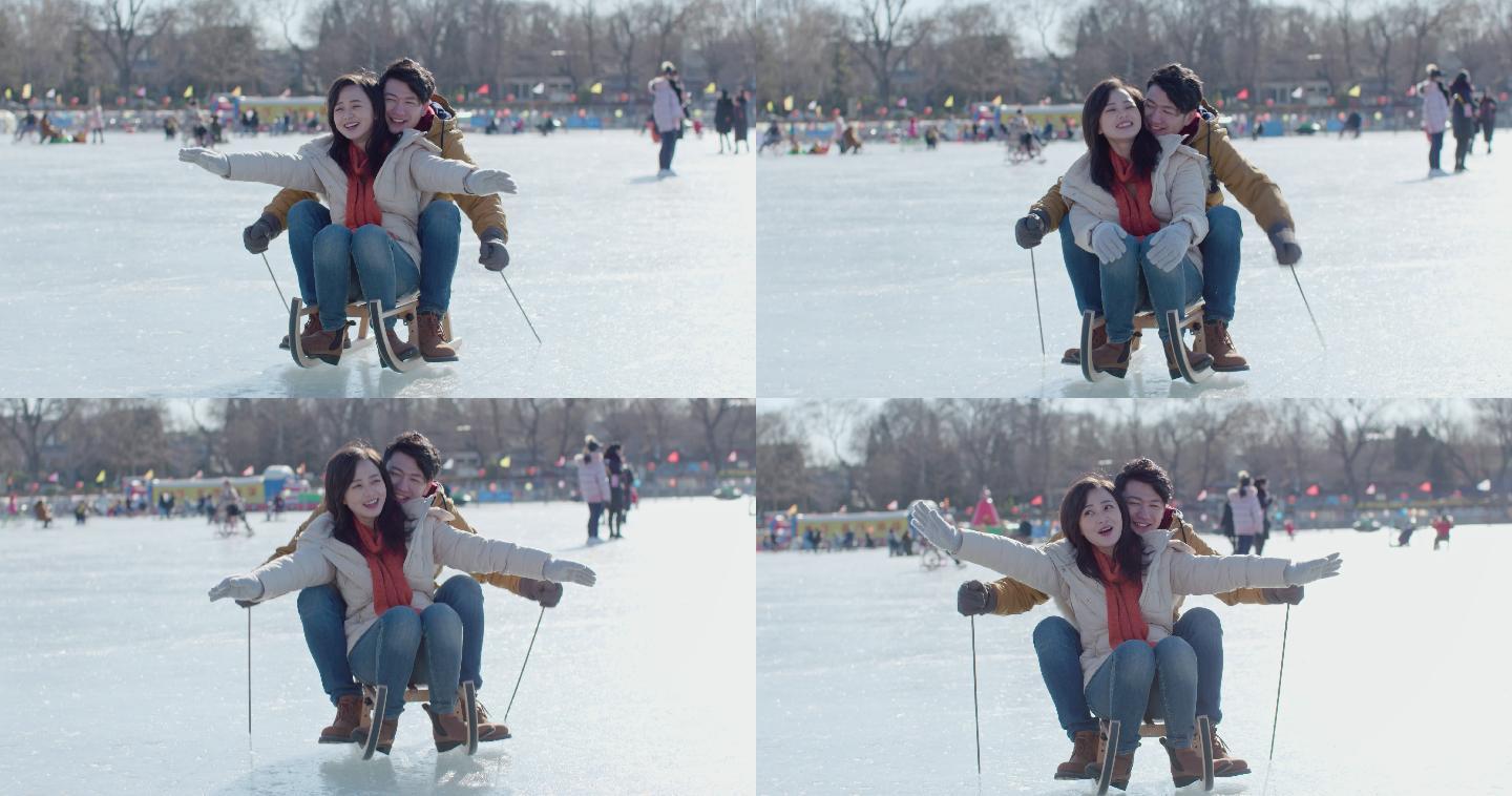 年轻情侣在冰上玩耍