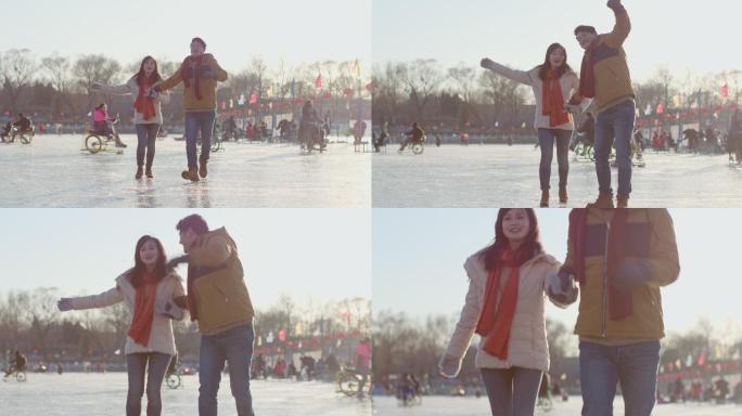 年轻情侣在冰上玩耍