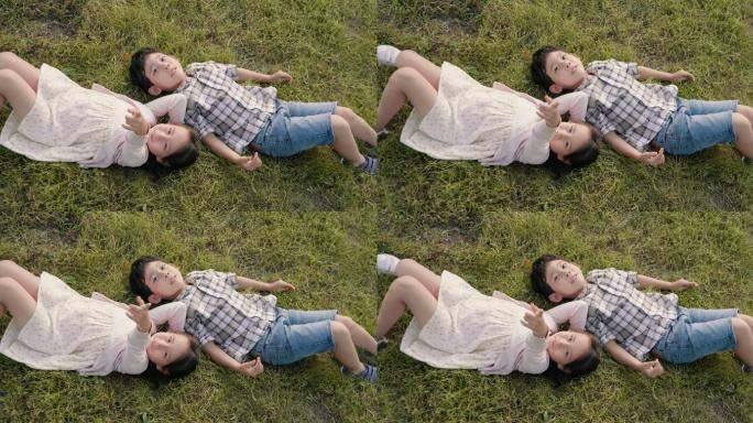 快乐的儿童躺在草地上