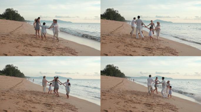 快乐家庭在沙滩奔跑