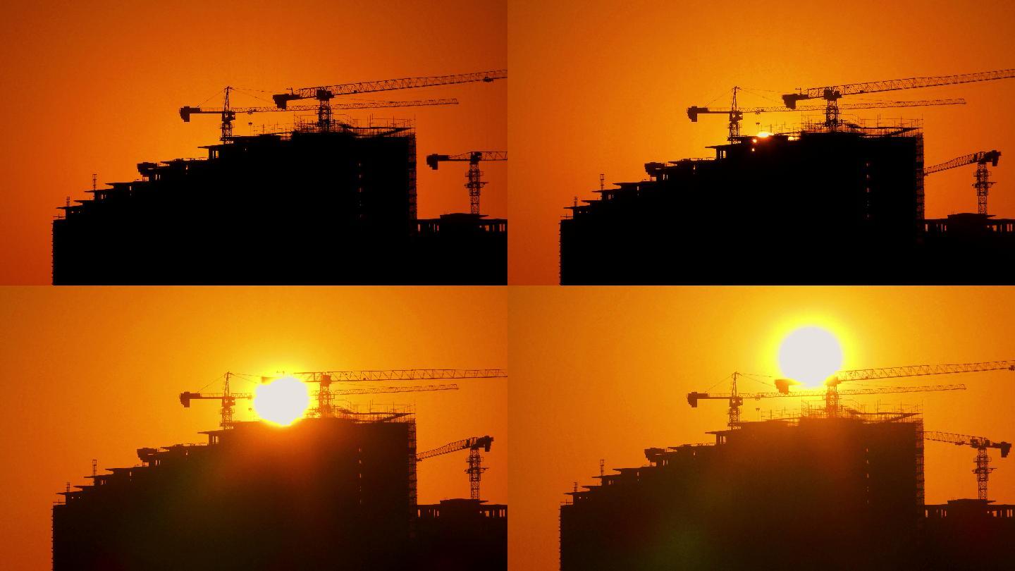 清晨，建筑工地塔吊日出