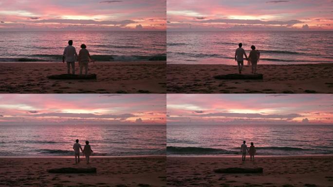 老年夫妇在海边看日落