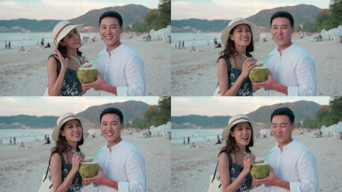 快乐的年轻情侣在沙滩度假