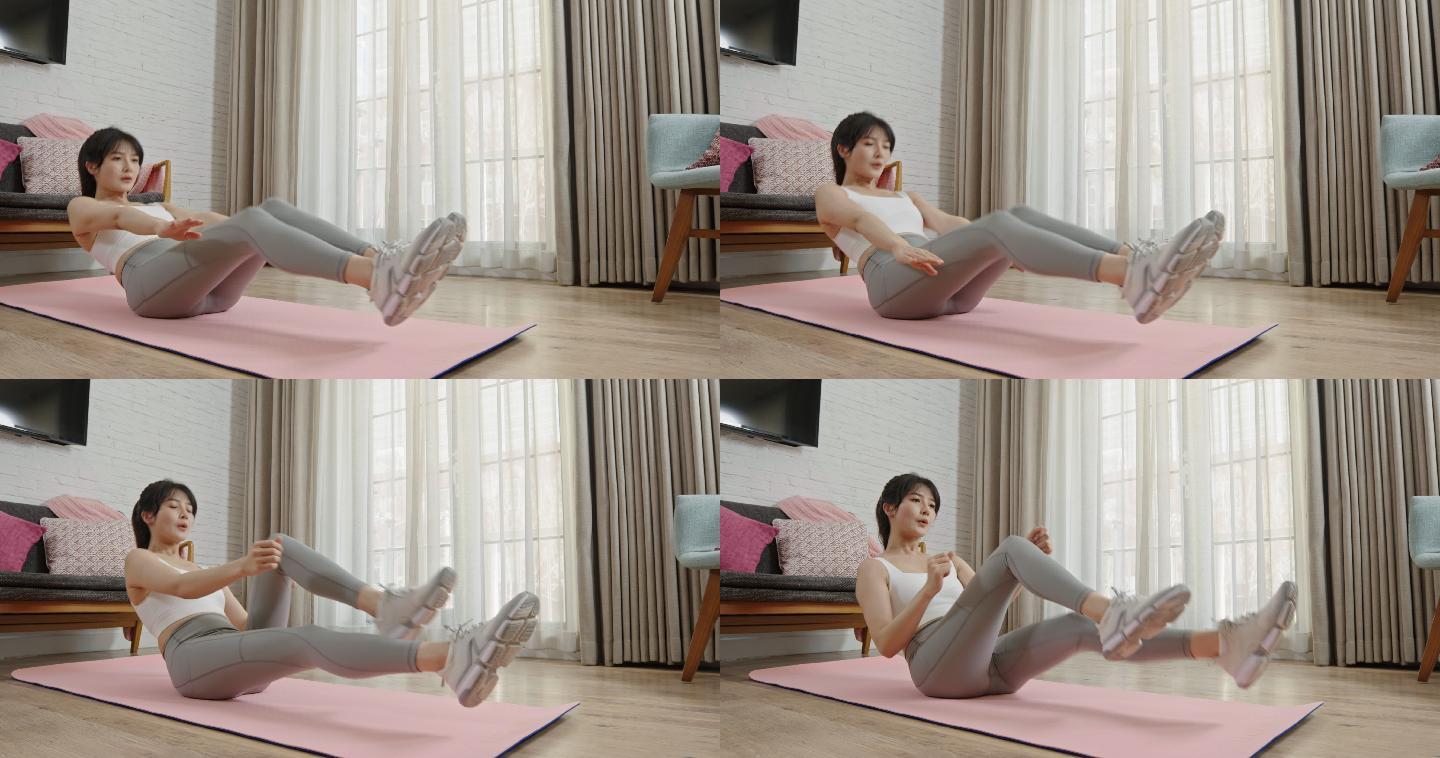 年轻女子在家健身身体塑性锻炼身体练习瑜伽