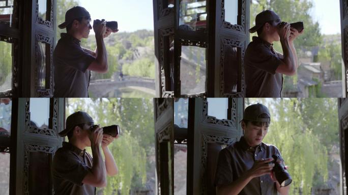 年轻摄影师使用相机拍照