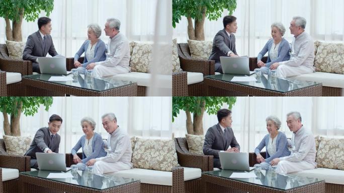 老年夫妇与理财顾问在客厅谈话