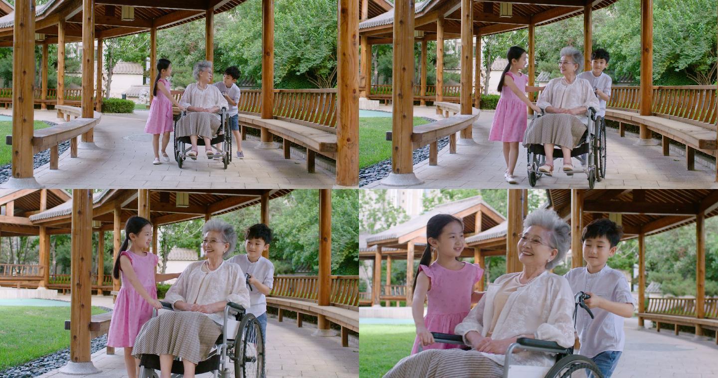 孙子孙女给老人推轮椅