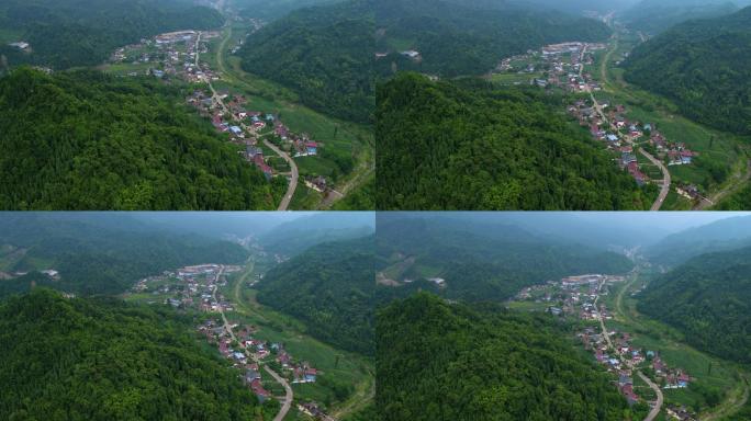 航拍公路两侧村庄在青山绿水间