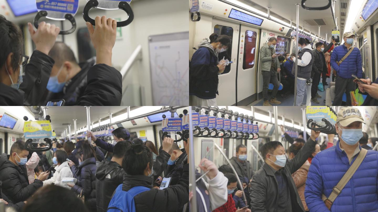 地铁上看手机的低头族