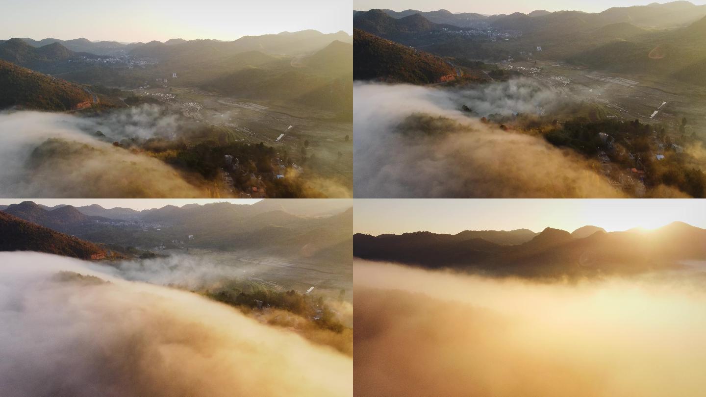 航拍清晨山谷云雾缭绕下村庄
