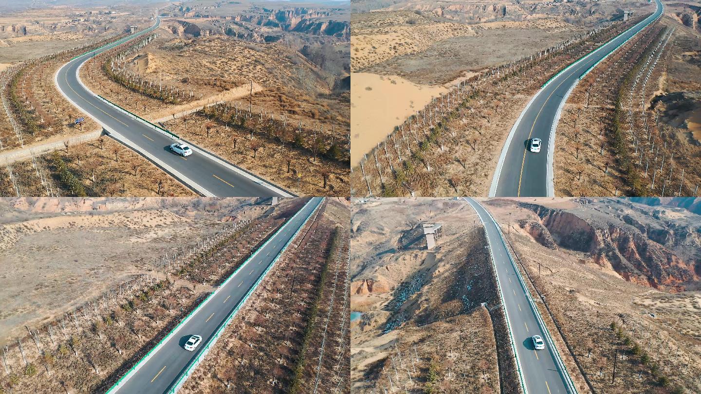 航拍汽车行驶在黄土高坡的公路上